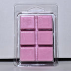 Pink wax melts in a clear plastic packaging on a light gray background