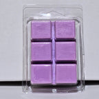 Purple wax melts in a clear packaging on a light gray background